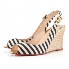 Sandalias de cuña Christian Louboutin Puglia de 80 mm en negro y dorado. Sandalias de cuña Christian Louboutin Puglia de 80 mm en negro y dorado.